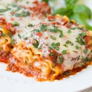 A close up of lasagna roll ups on a plate