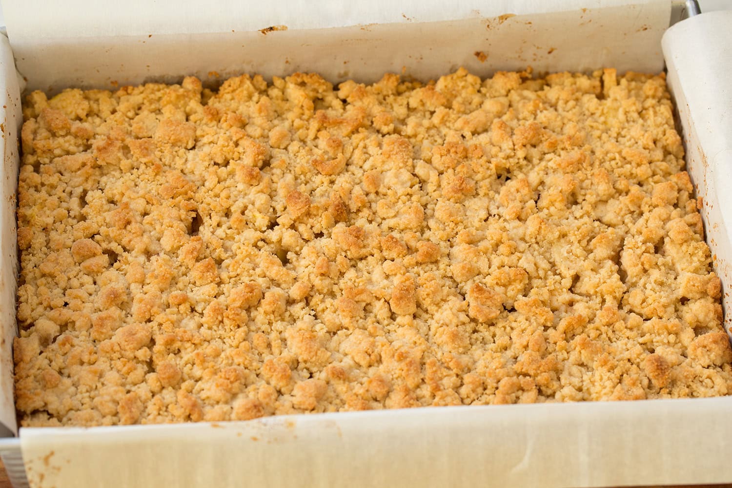 Apple Pie Bars Apple Pie Bars shown completed after baking, with golden brown crumble on top.