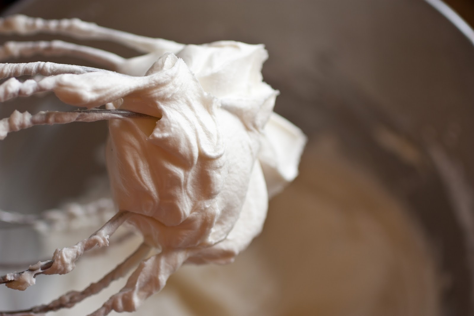 buttercream frosting on the end of a whisk