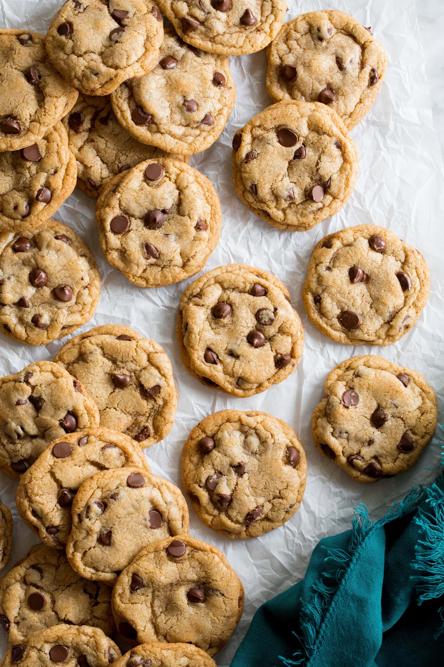 Completed browned butter chocolate chip cookies shown from above on parchment paper.