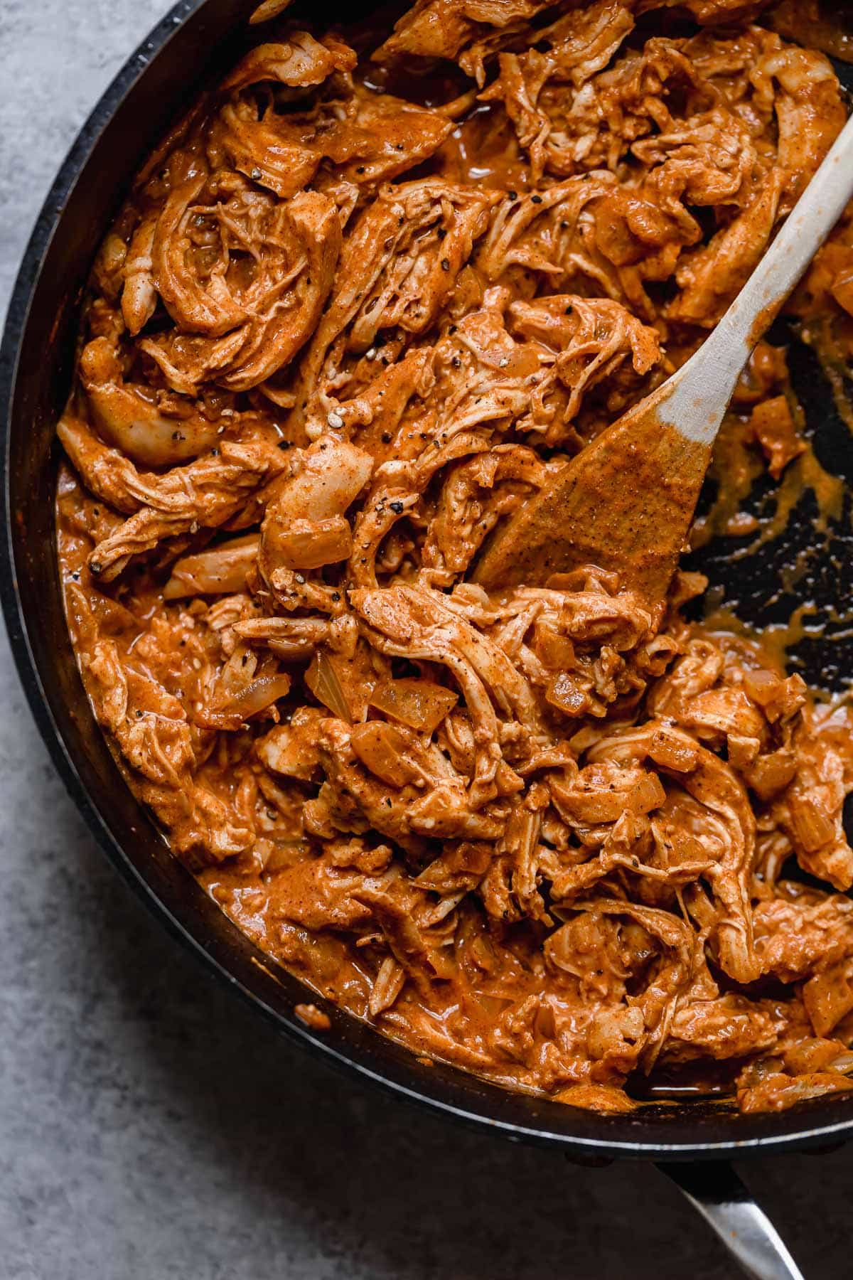 Chicken Chimichangas - one of the ultimate comfort foods! Perfectly hearty and layered with delicious ingredients like seasoned chicken, rich refried beans and shredded Mexican cheese. They're perfectly crisp and oh so satisfying! #chimichanga #chicken #mexican #recipe #refriedbeans #dinnerideas Chicken chimichanga filling