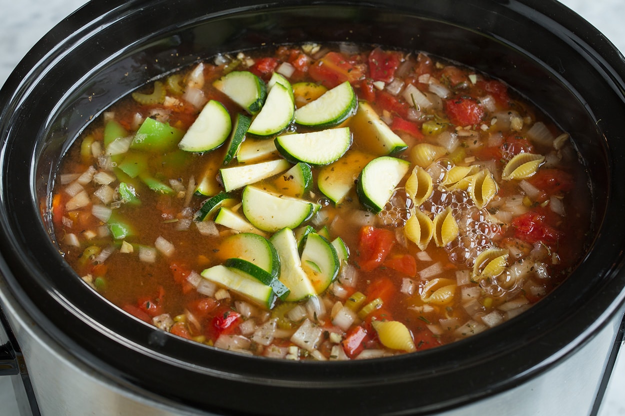 Minestrone Soup Adding zucchini, beans and pasta to slow cooker.
