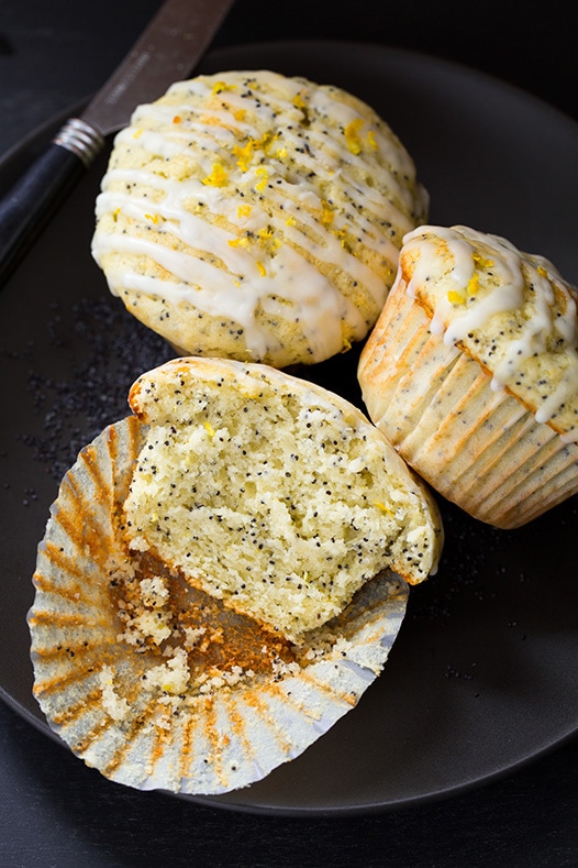 three Lemon Poppyseed Muffins on plate with knife