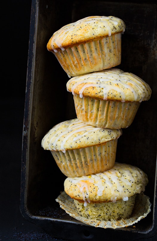 four Lemon Poppyseed Muffins stacked in baking dish