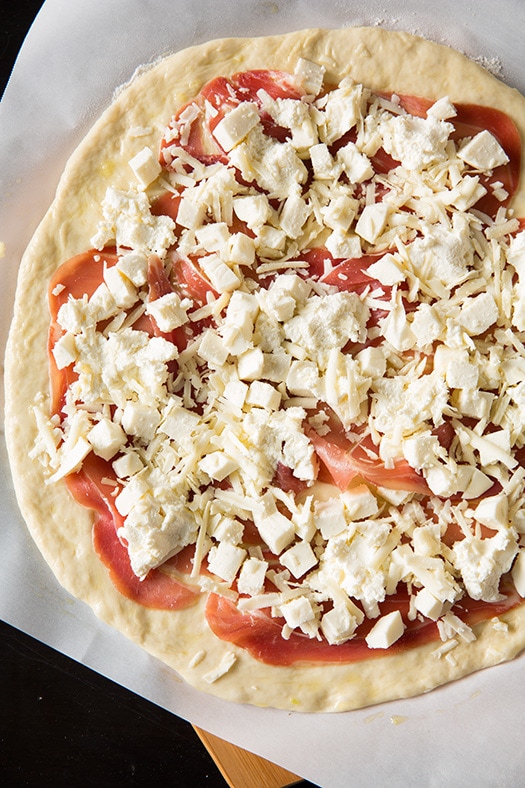 uncooked Three Cheese Peach Prosciutto pizza