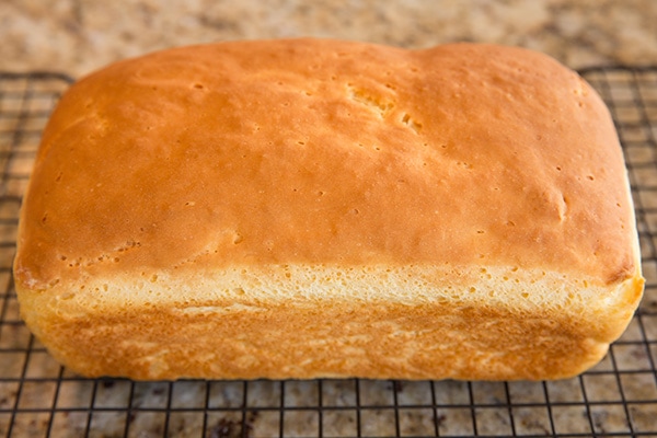 loaf of gluten free bread on wire rack