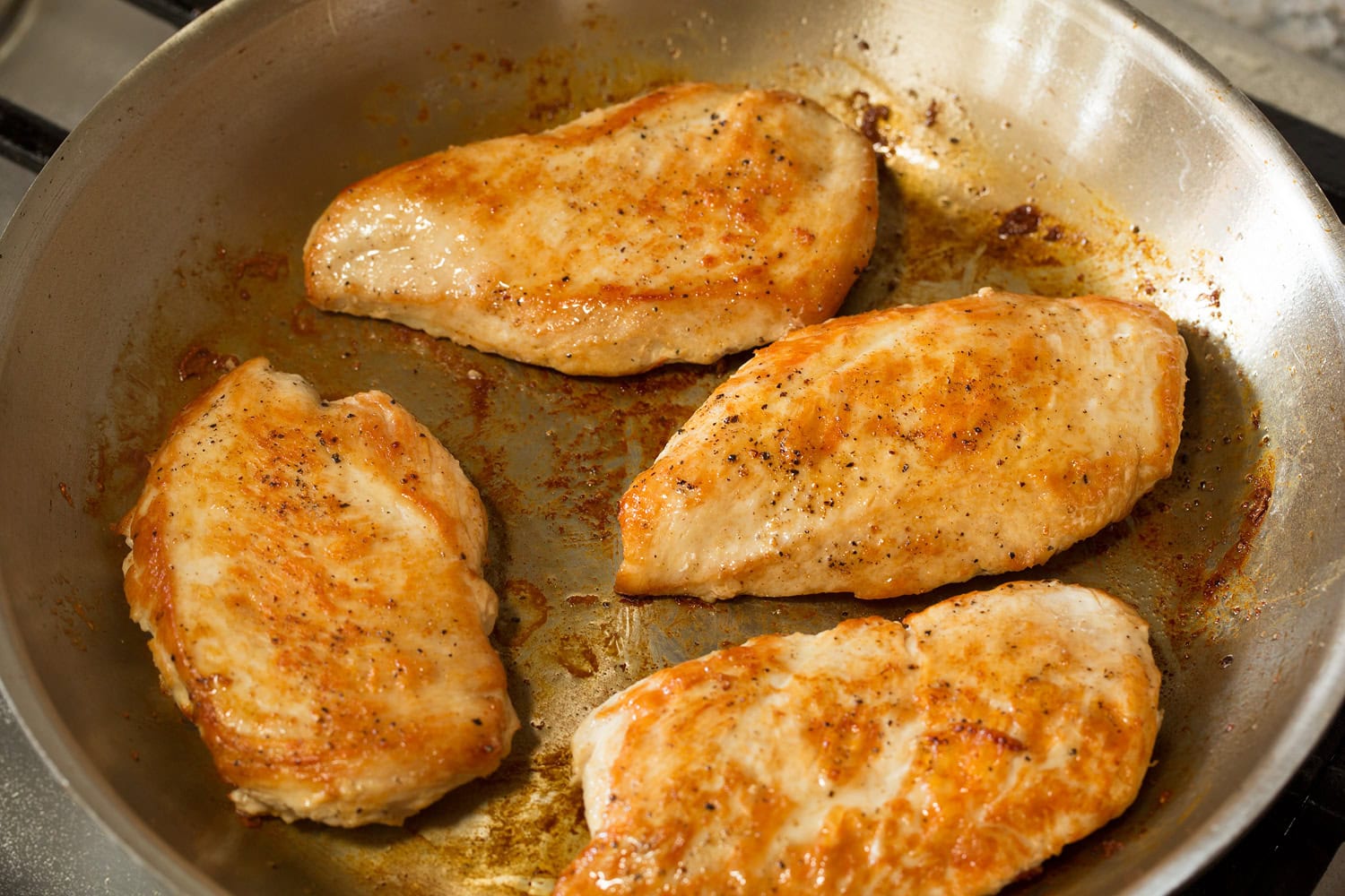 Pan seared chicken breasts that are golden brown.