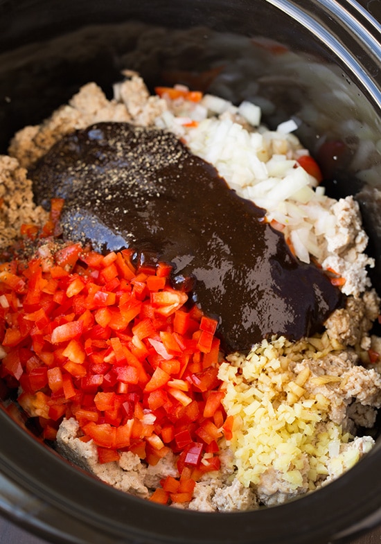 Ingredients in a slow cooker for making Asian Chicken Lettuce Wraps 