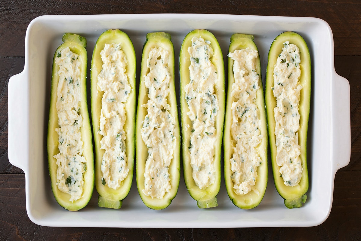 Cheese mixture layered into lasagna zucchini boats.