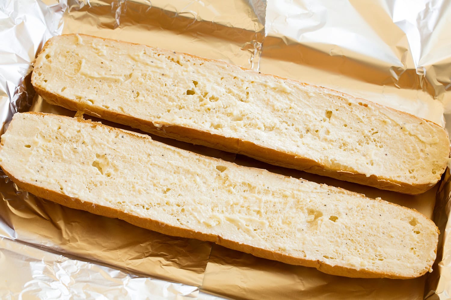 French bread halves slathered with garlic butter.