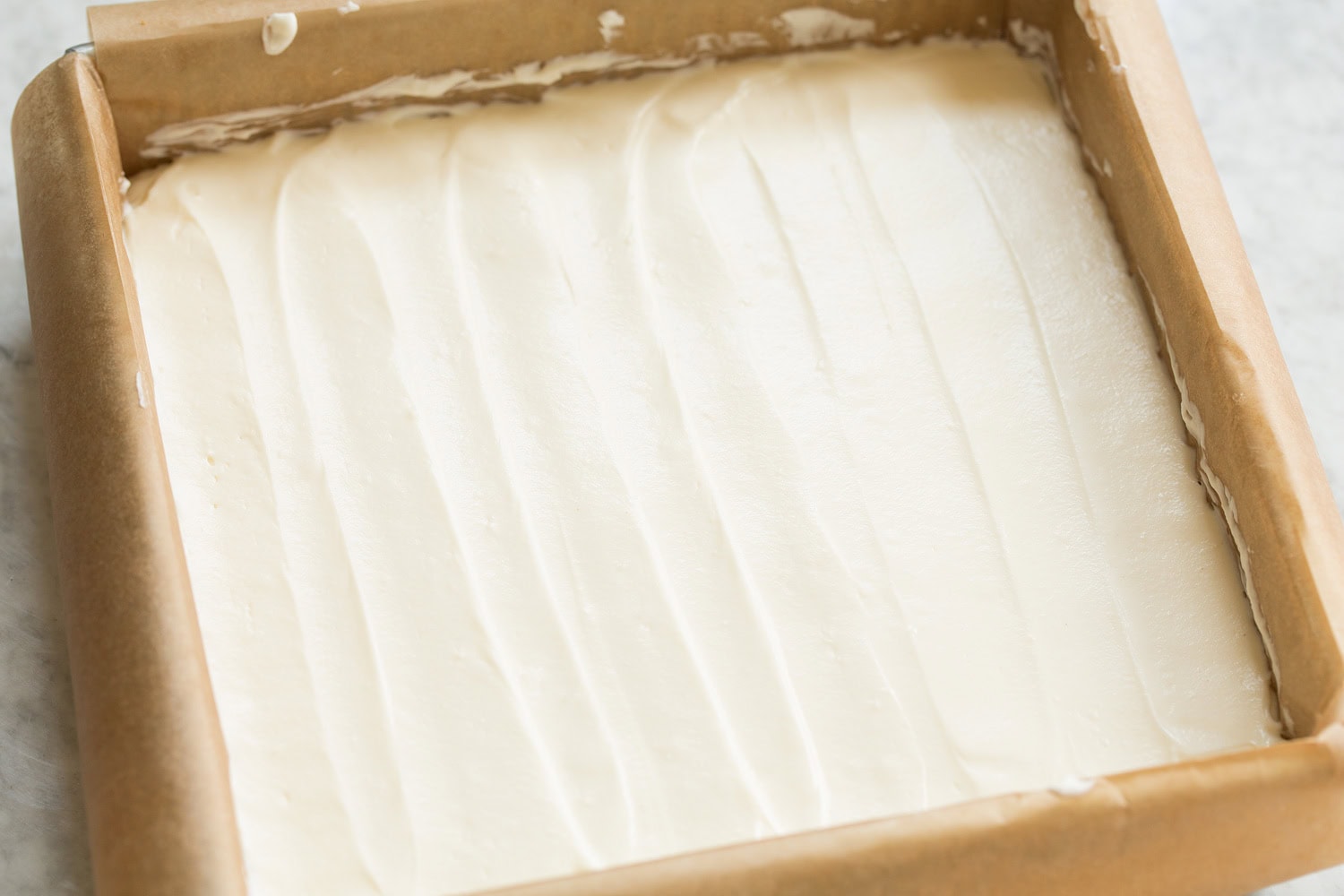 Cheesecake mixture after spreading over crust.