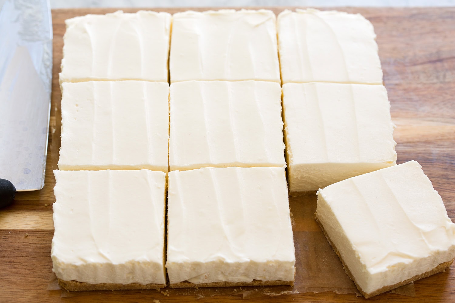 Cheesecake bars shown after chilled and set, and sliced.