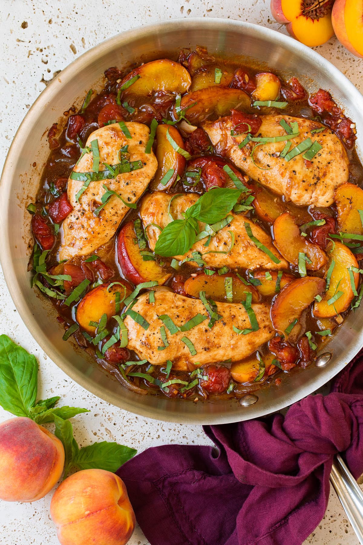 Peach chicken in a skillet.