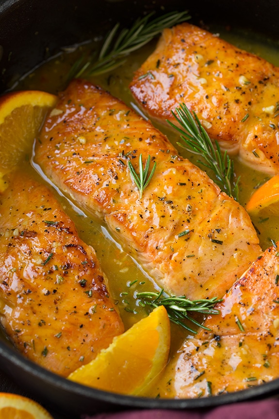 Salmon Recipe with rosemary and orange cooking in skillet