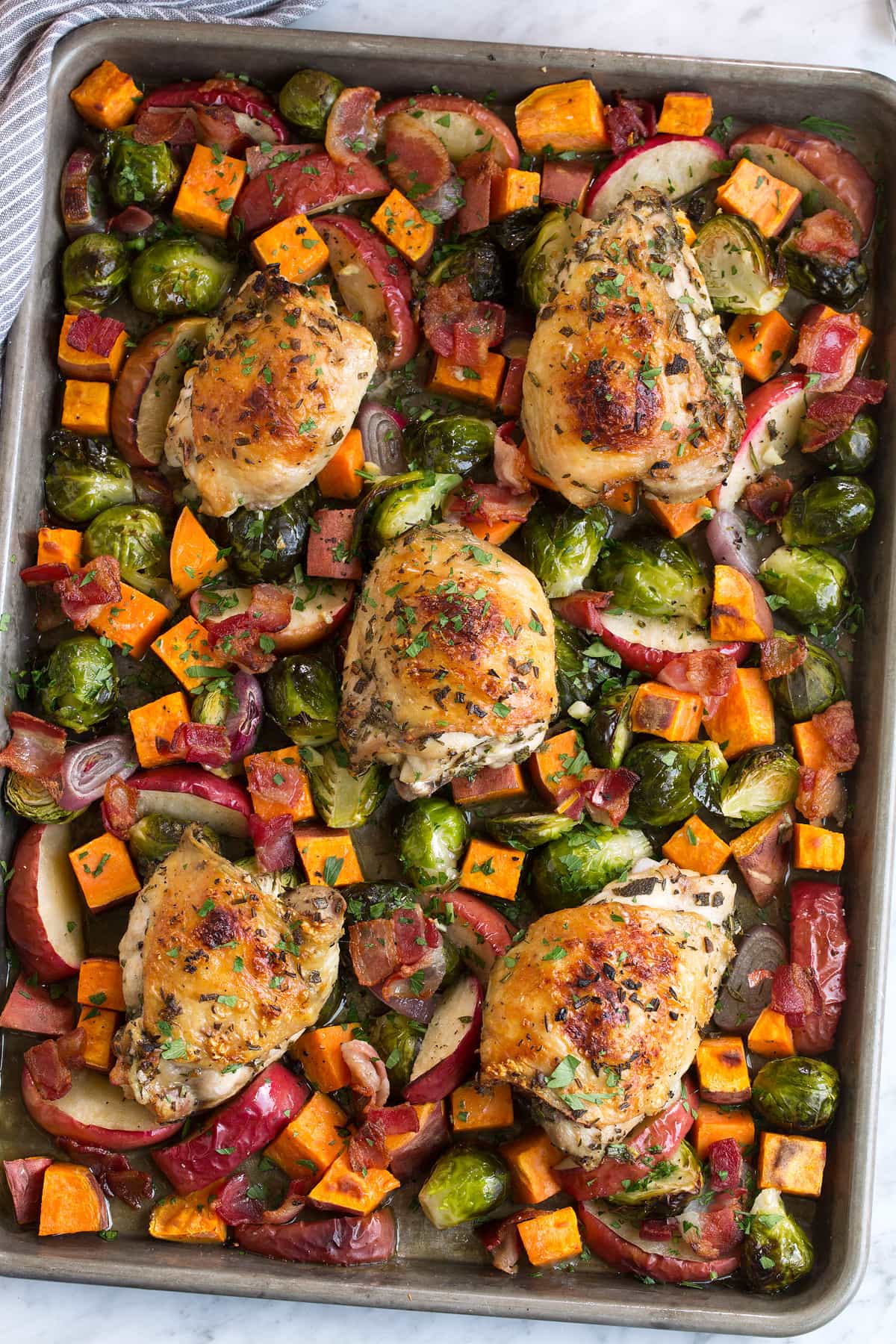 Sheet pan with roasted chicken and fall vegetables