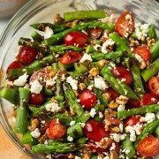 An asparagus and feta salad in a glass bowl