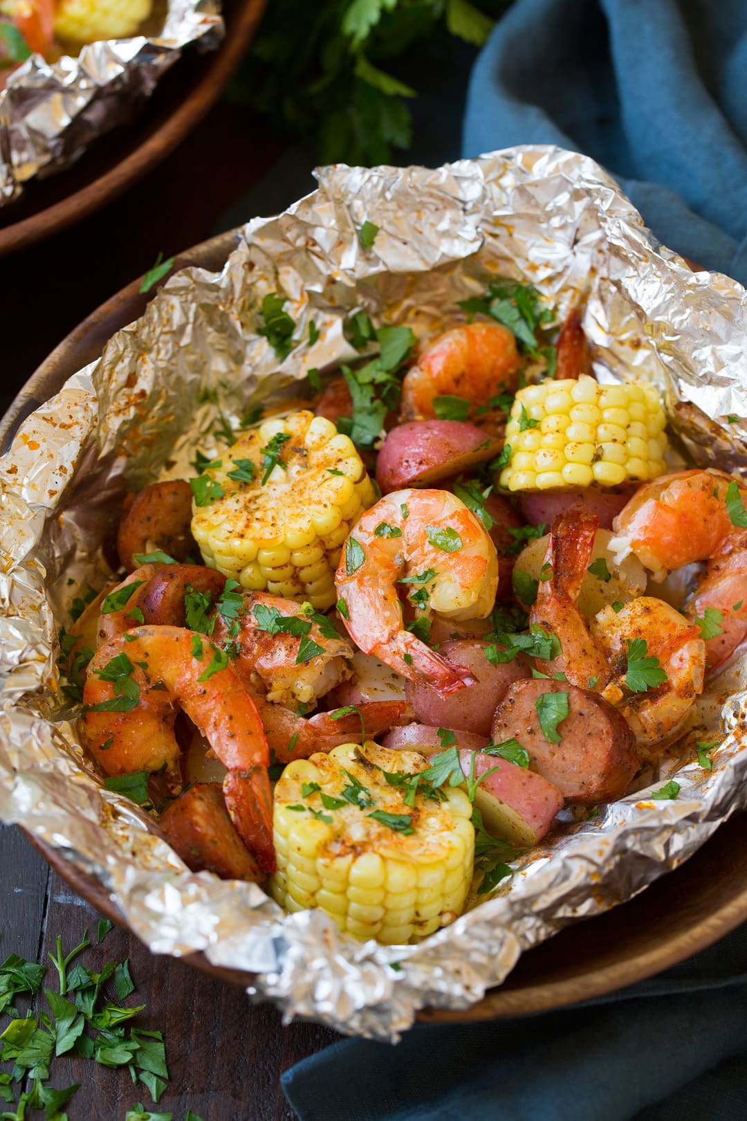 Shrimp Boil Packets with shrimp, corn cobs, sausage, potatoes and seasoning.