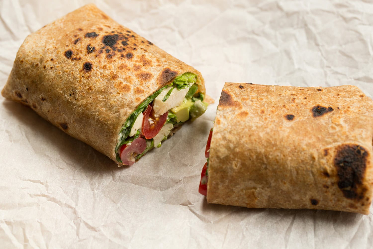 Chicken Caesar Wrap Wrap sliced in half.