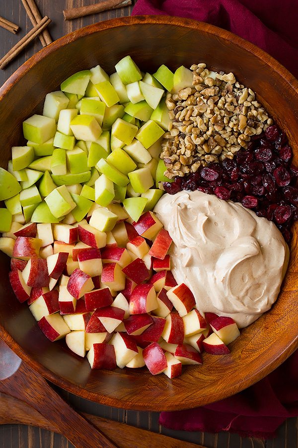 Apple Fruit Salad ingredients in a mixing bowl before tossing.