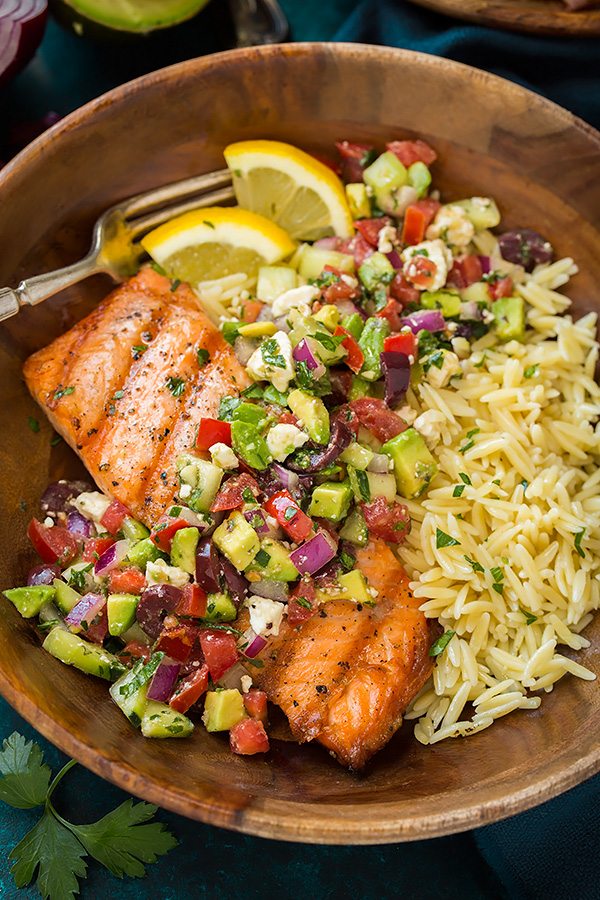 Grilled Salmon with Avocado Greek Salsa and Orzo Grilled Salmon in a wooden single serving bowl with Avocado Greek Salsa and Orzo