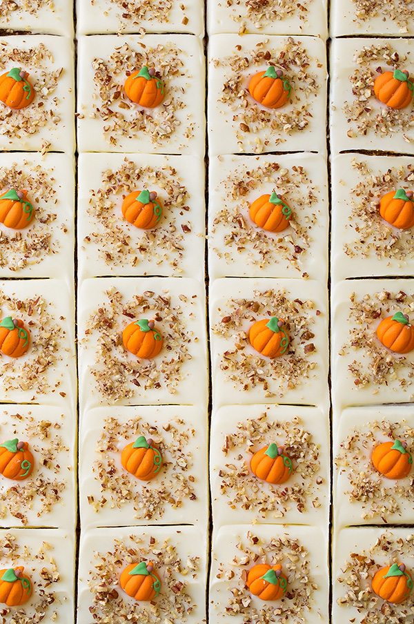 Overhead image of 24 slices of pumpkin cake in a baking sheet.