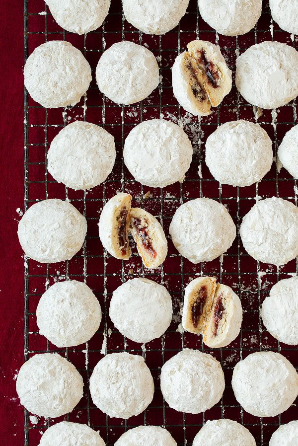 Raspberry Almond Snowball Cookies with jam center.