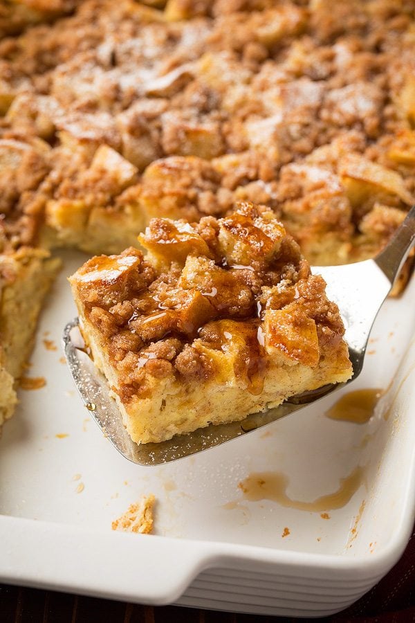 Slice of warm overnight french toast casserole on serving spatula