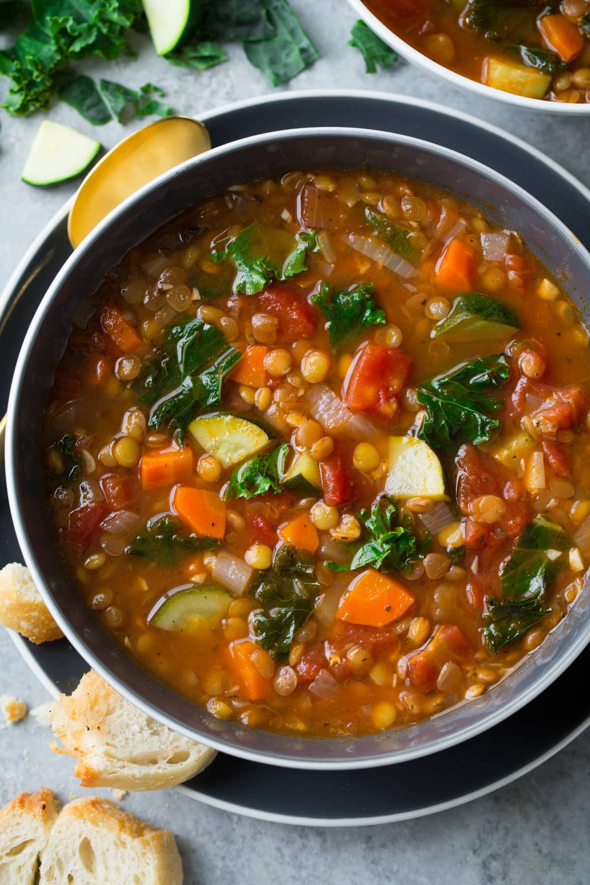 Up close image of lentil soup in a single serve soup bowl