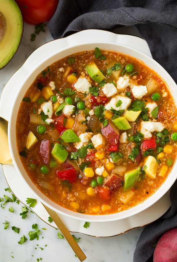 Quinoa and Vegetable Stew overhead image in a white bowl.