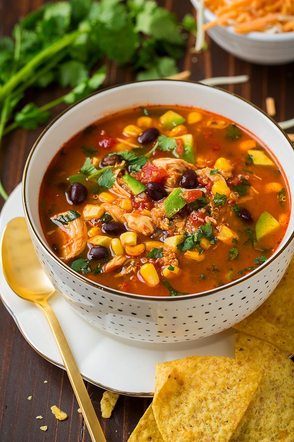 Slow Cooker Chicken Enchilada Soup in a single serve white bowl.