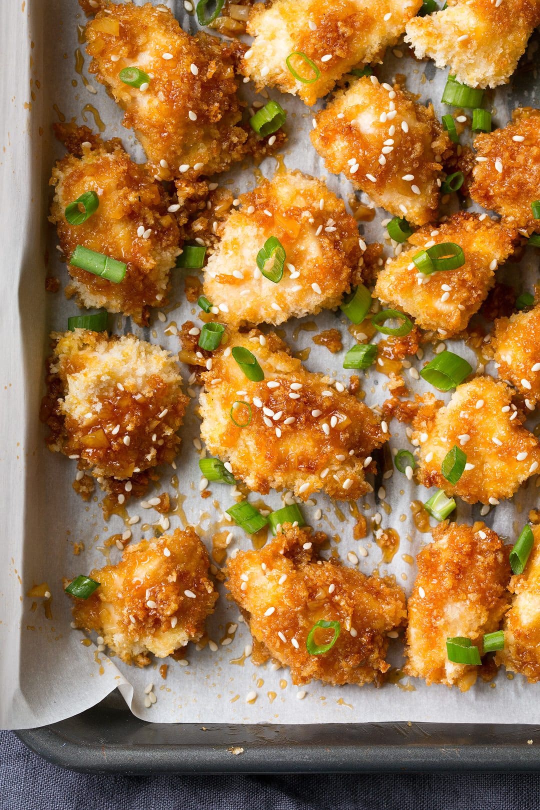 Close up image of honey garlic chicken to show texture of panko and sticky sauce.