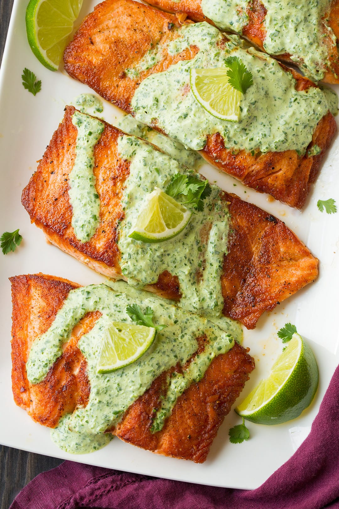 four cilantro lime salmon drizzled with cilantro sauce