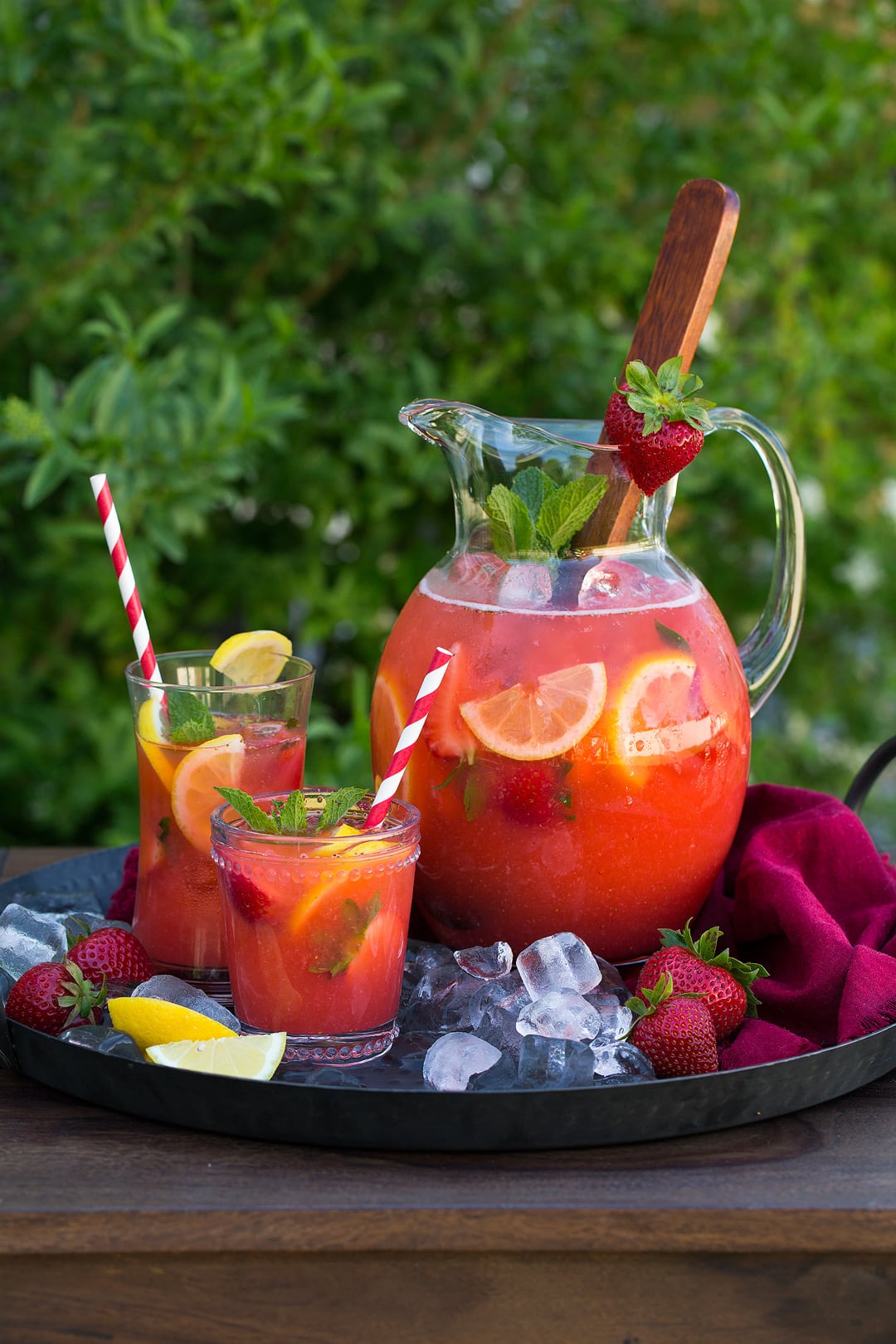 pitcher and two glasses of Strawberry Lemonade on tray