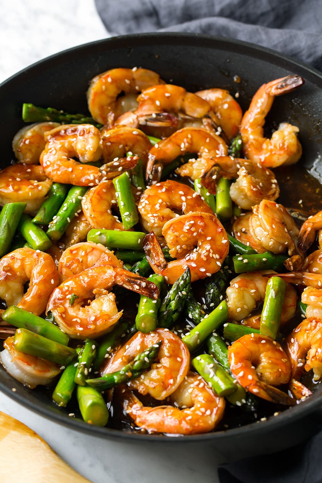 Teriyaki Shrimp and Asparagus stir fry in a large skillet