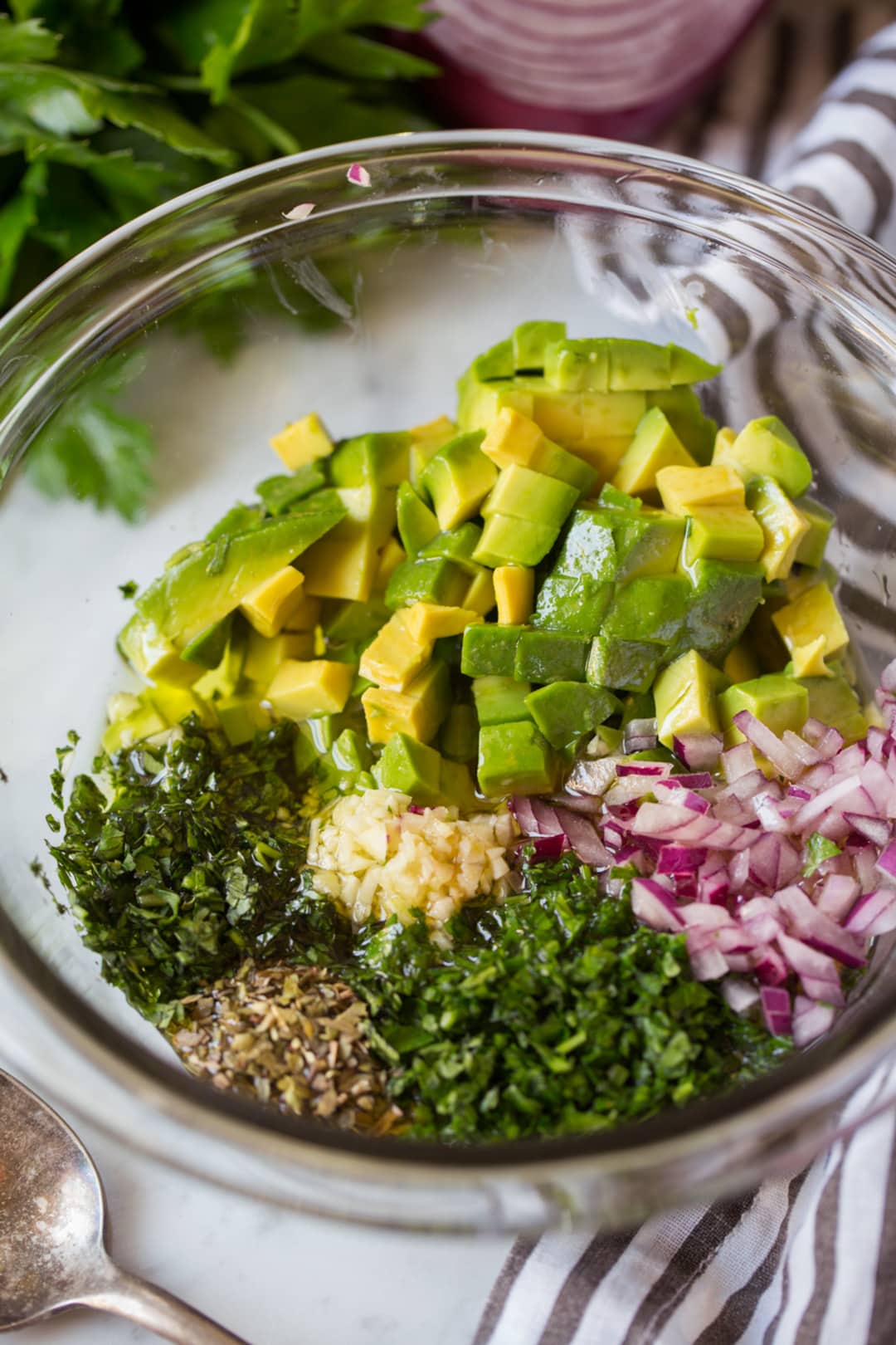 Avocado Chimichurri in a bowl before mixing. Topping for grilled salmon.
