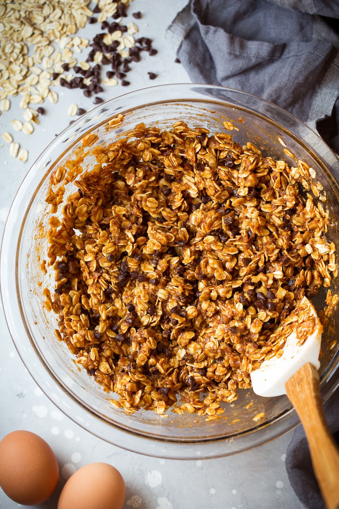 Breakfast Cookies batter in a bowl with oats, pumpkin and chocolate chips.
