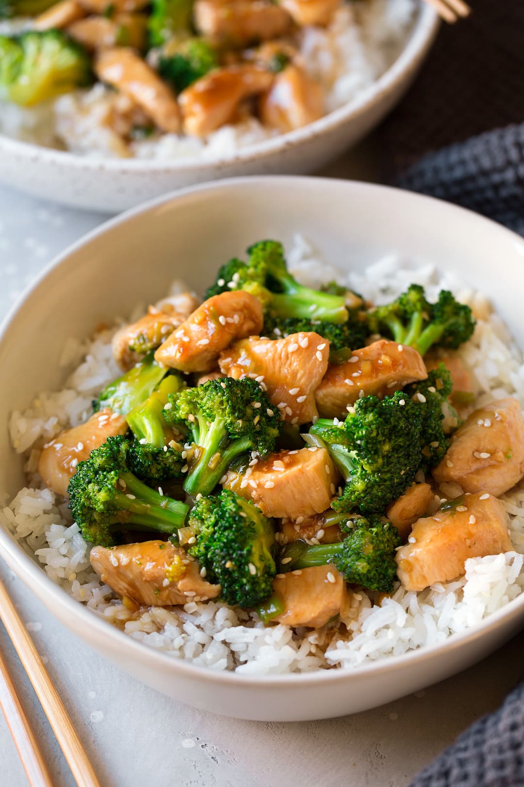 Chicken and Broccoli Stir Fry atop white rice in large bowl