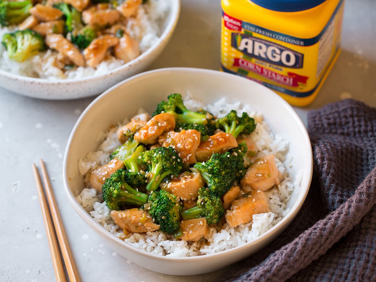 Chicken and Broccoli Stir Fry in bowl next to container of cornstarch 