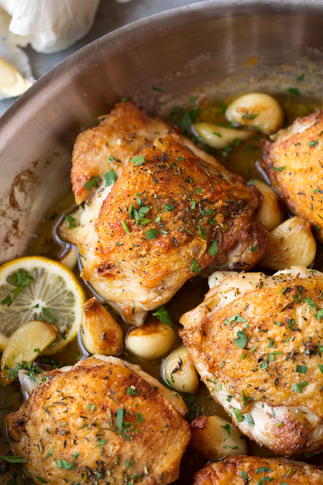 Roast chicken with garlic in skillet