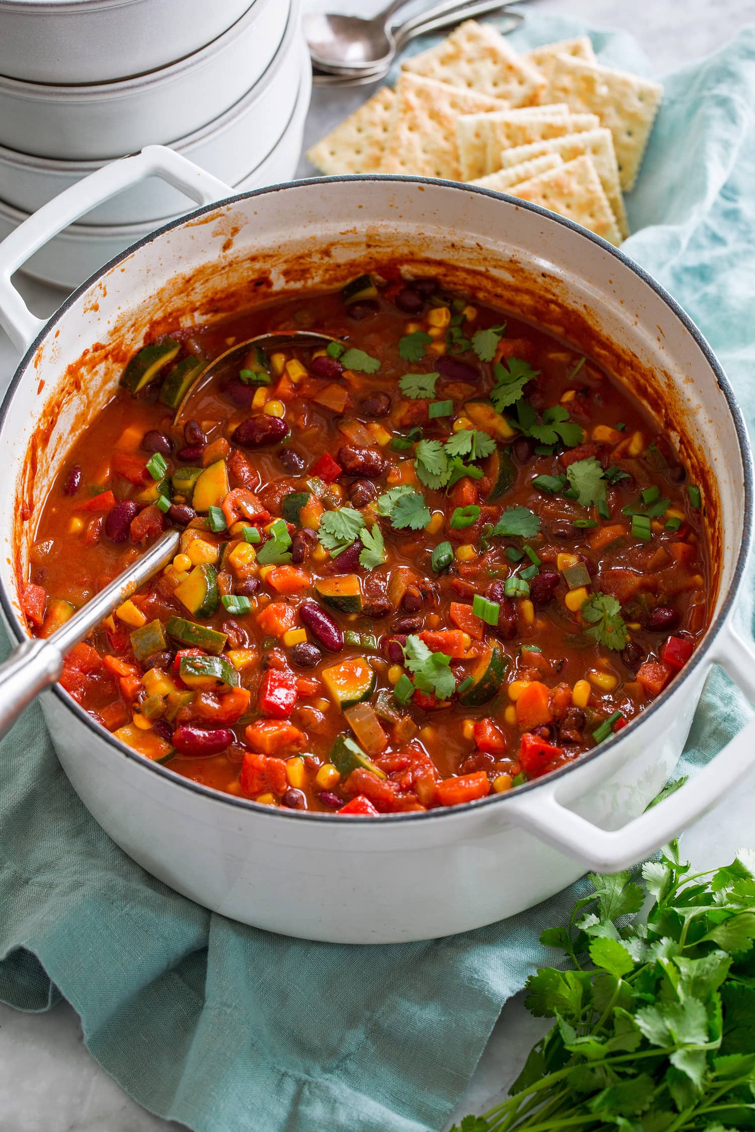 Vegetarian chili in a large white pot.