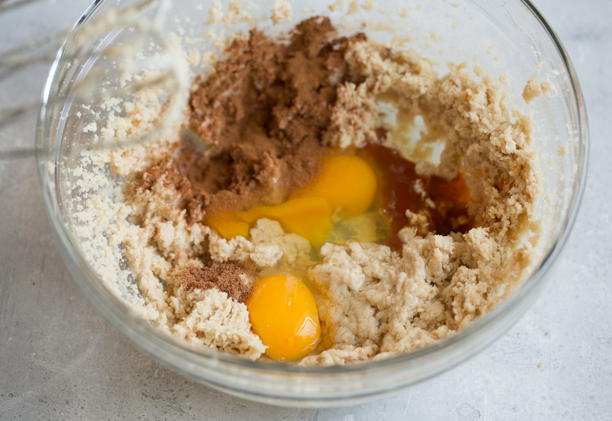 adding eggs vanilla and spices