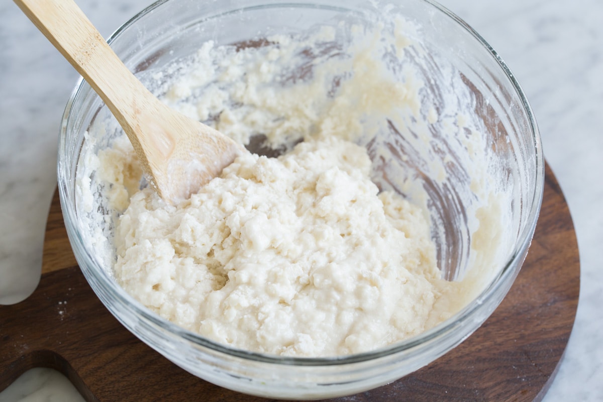 Finished peach cobbler topping in a mixing bowl.