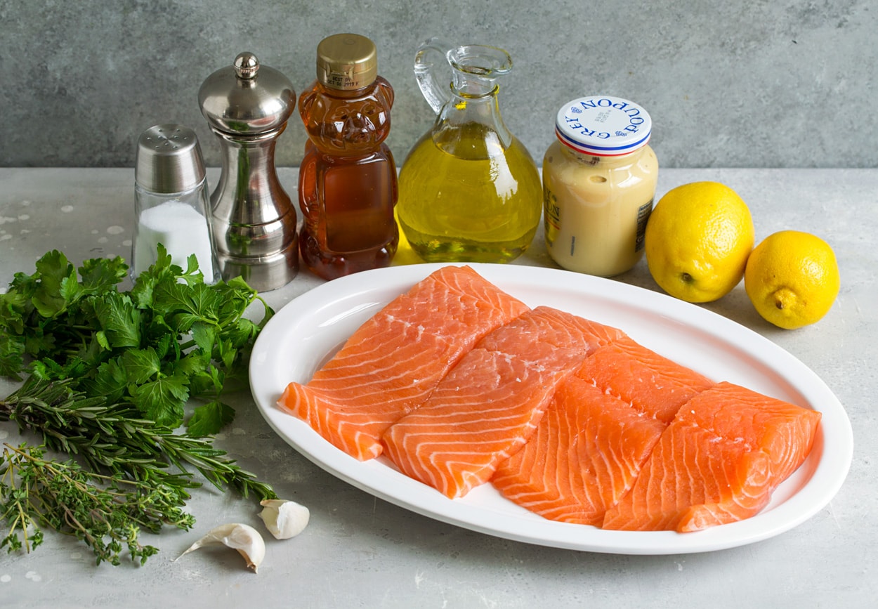 ingredients for grilled salmon lemons mustard olive oil honey salt pepper fresh herbs garlic salmon