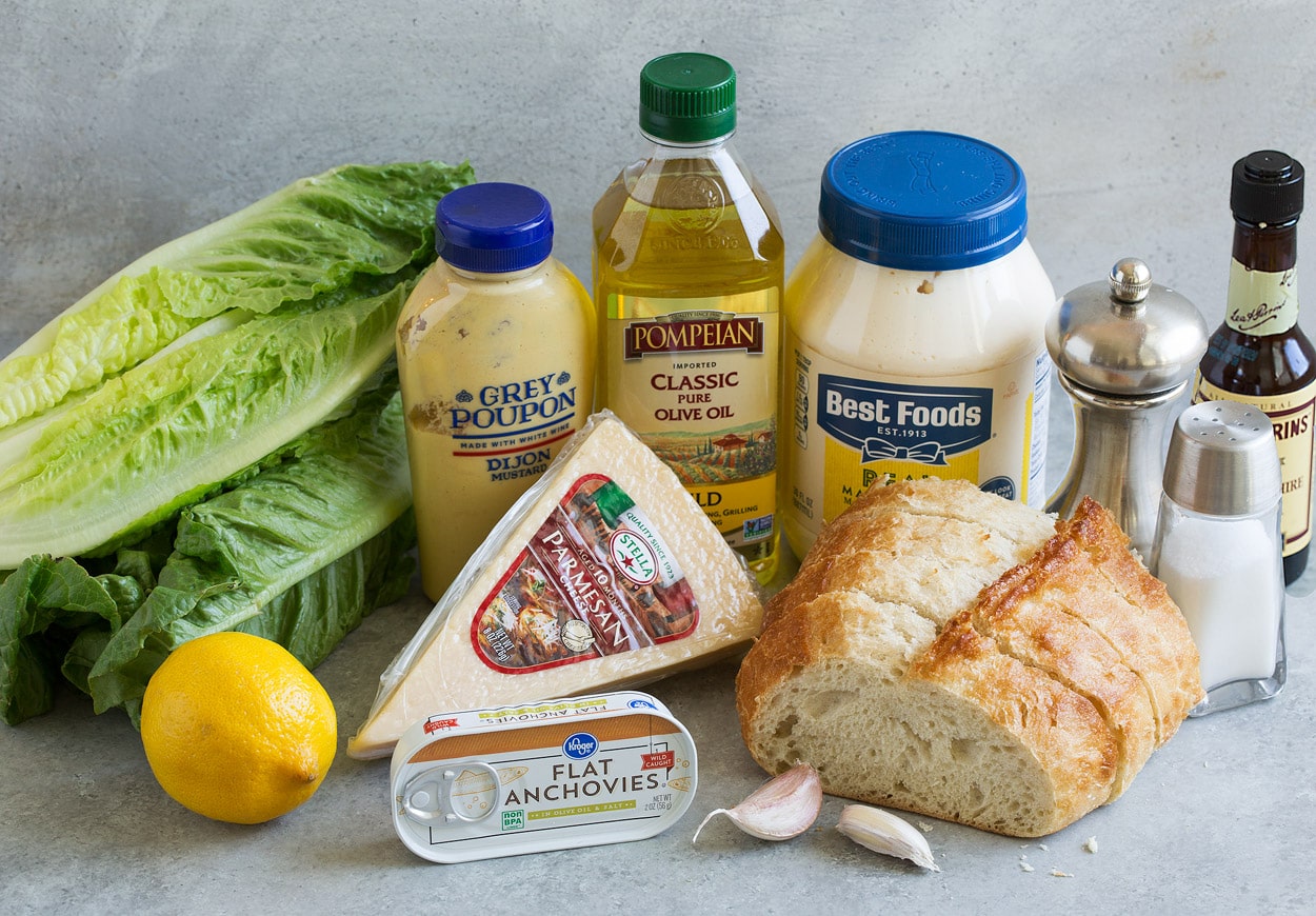 Ingredients for Caesar Salad romaine lettuce lemon anchovies garlic bread parmesan dijon mustard olive oil mayonnaise salt pepper Worcestershire