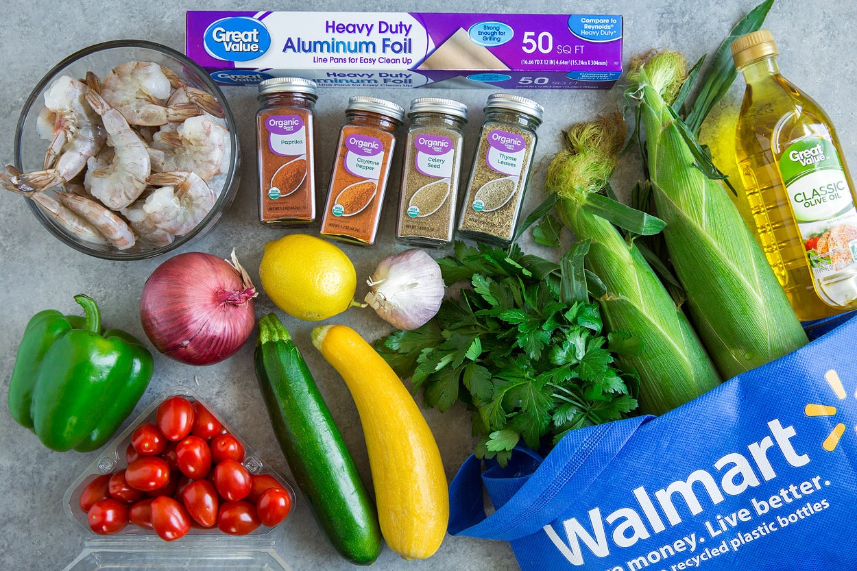 Shrimp Foil Packs ingredients olive oil corn parsley squash zucchini tomatoes bell pepper red onion lemon garlic spices shrimp