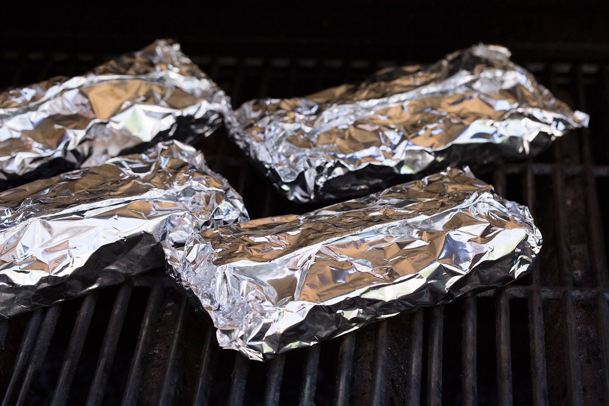 Shrimp and Veggie Foil Packs wrapped on grill