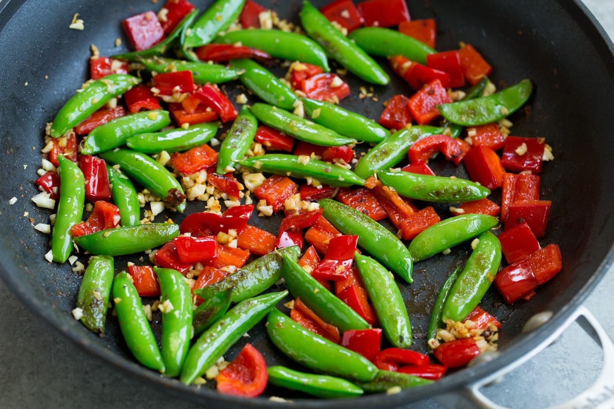 Orange Garlic Shrimp sauteing sugar peas bell pepper garlic ginger