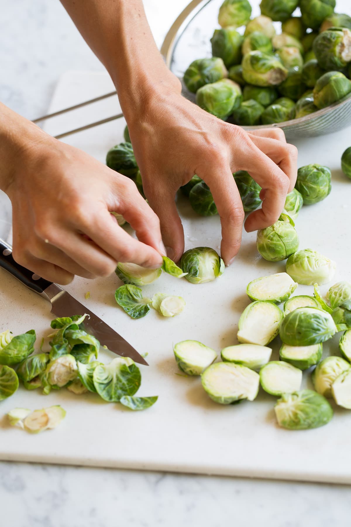 Photo of showing how to prep brussels sprouts before roasting