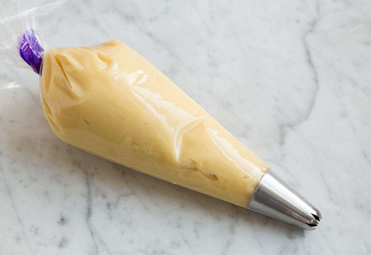 churro batter in piping bag fitted with star tip