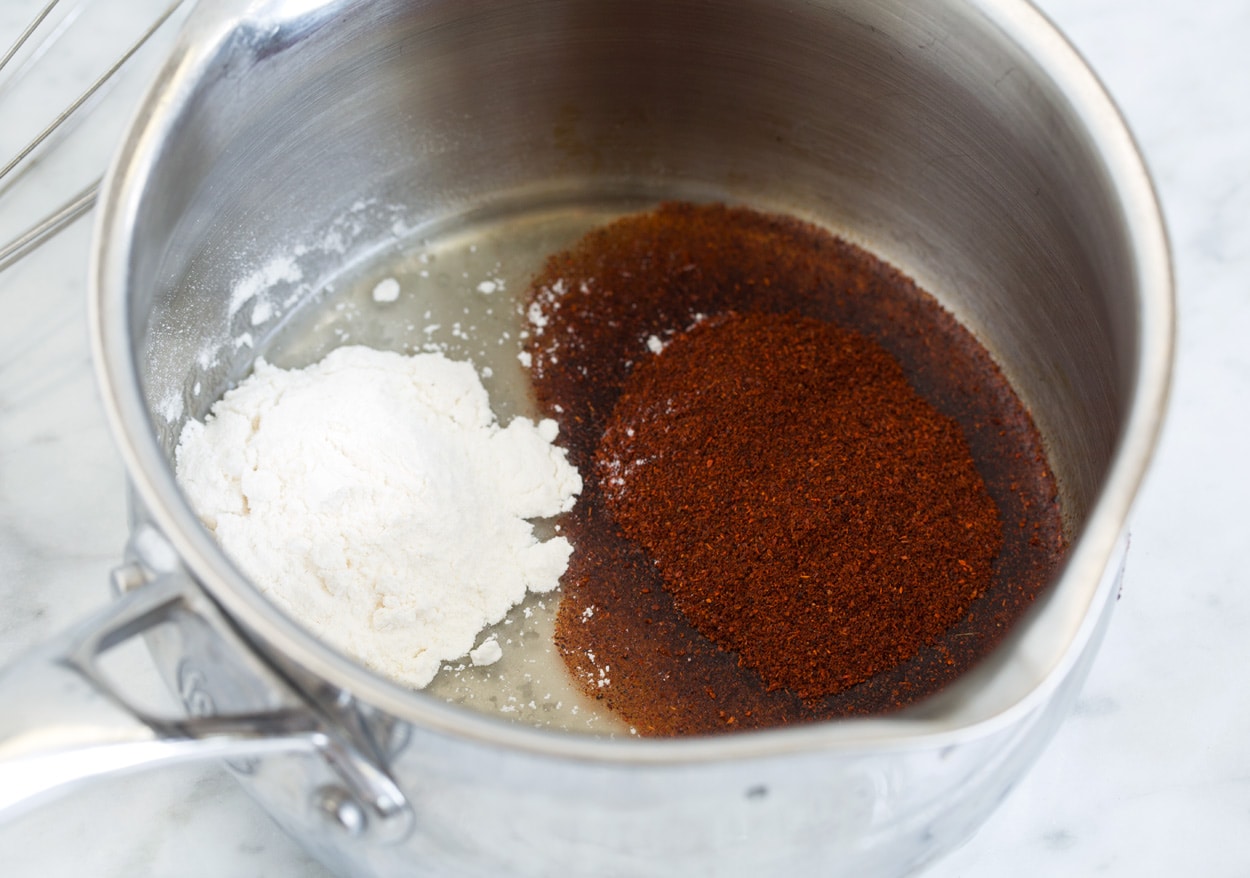 making in a metal saucepan Enchilada Sauce